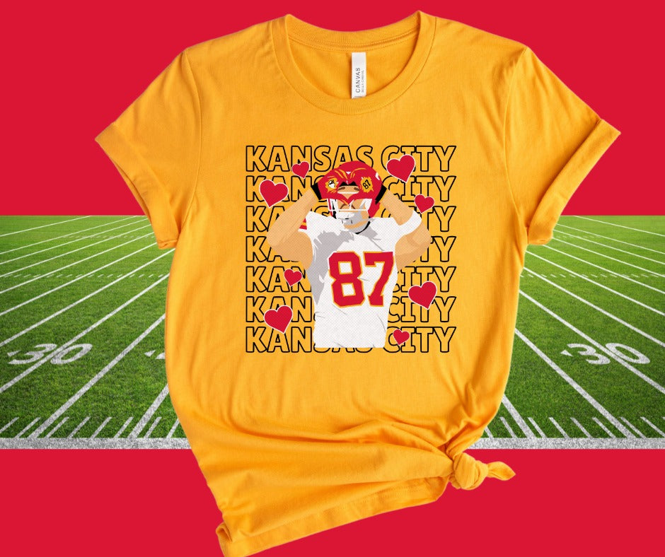 Kansas City Repeat Travis Kelce Heart Hands Gold Graphic Tshirt - The Red Rival